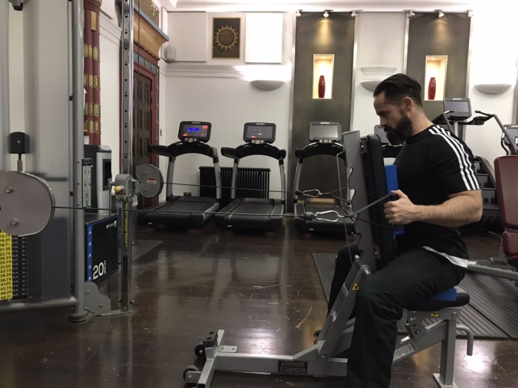 Seated row with trunk support for shoulder injury rehab