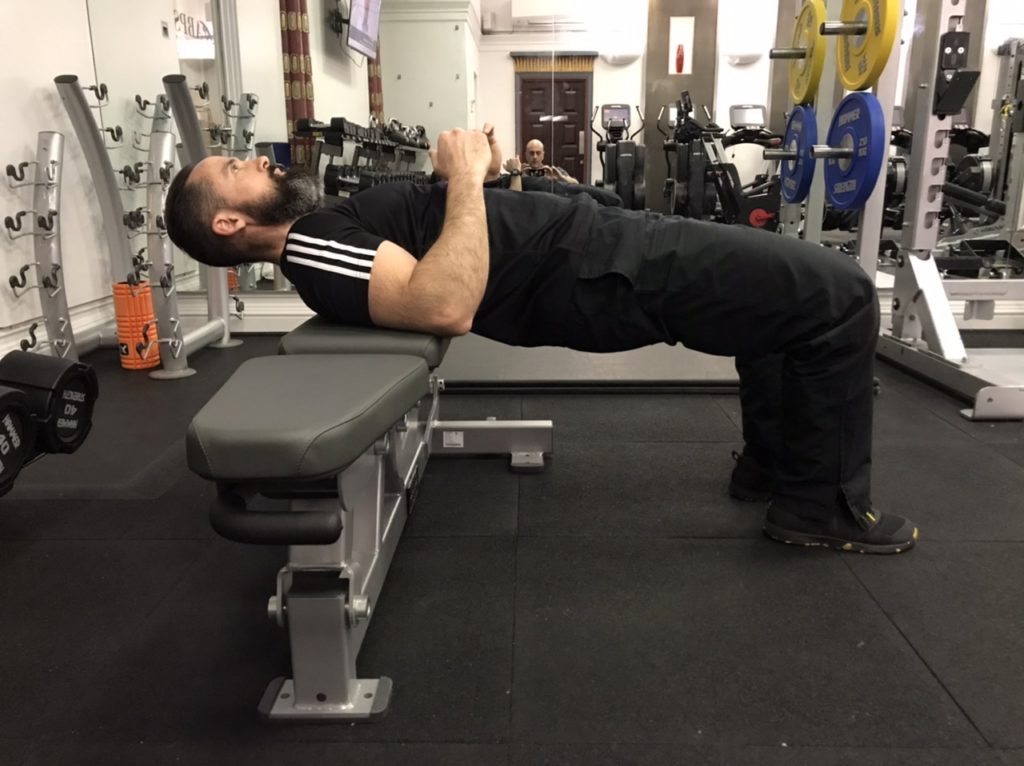 Glute bridge hold from a bench